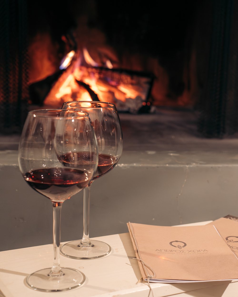 Wine by the fireplace, restaurant photography in Lefkada