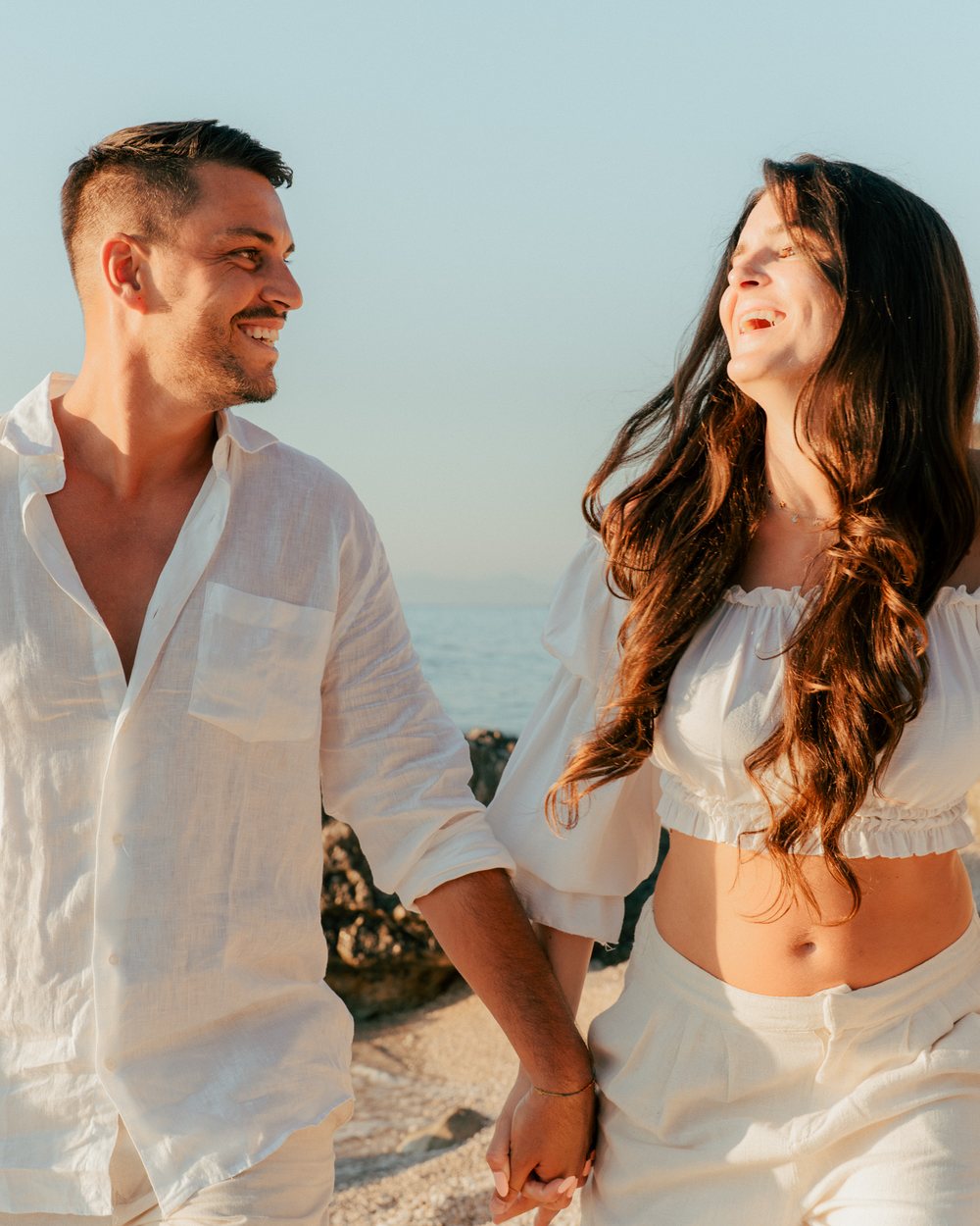 Couple at sunset by the sea in Lefkada