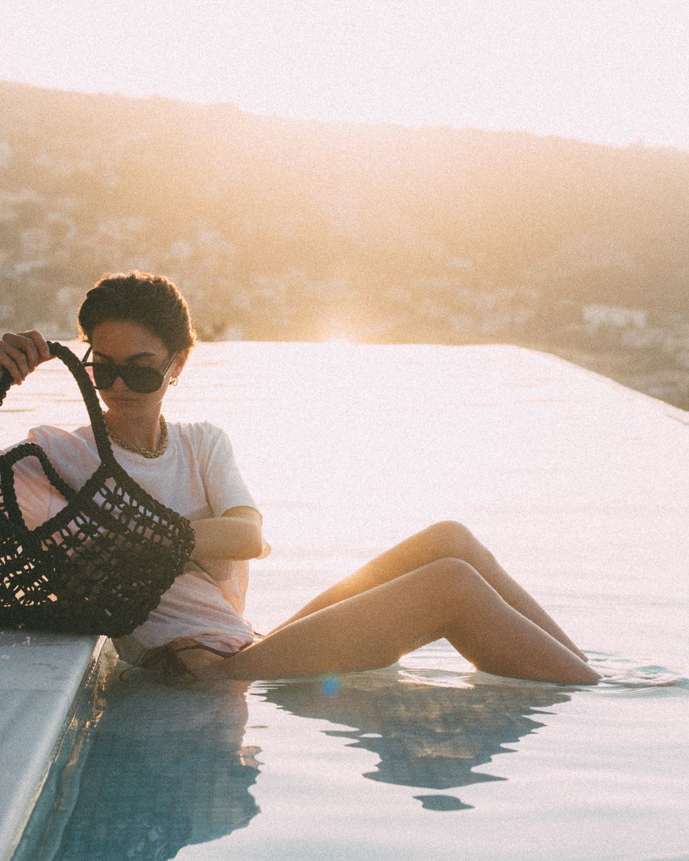 Product photography by an infinity pool in Lefkada